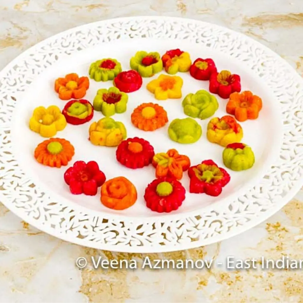 A white plate with cooked marzipan candy.