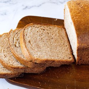 Sliced brown bread on the table.