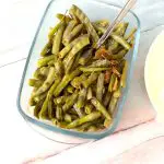 A glass bowl with sauteed cluster beans.