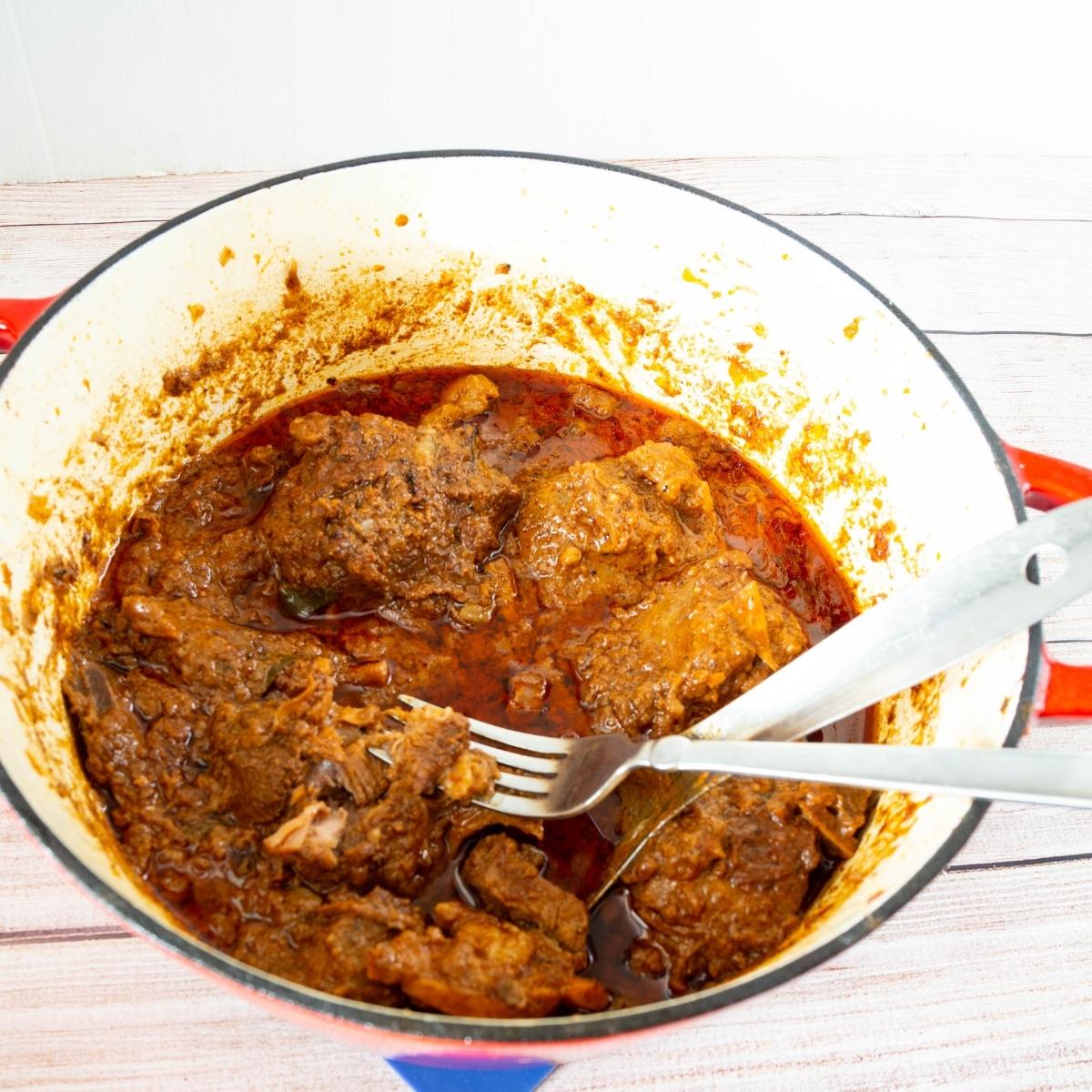 A Dutch oven with mutton curry.