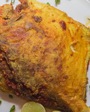 A pomfret with green masala stuffing.