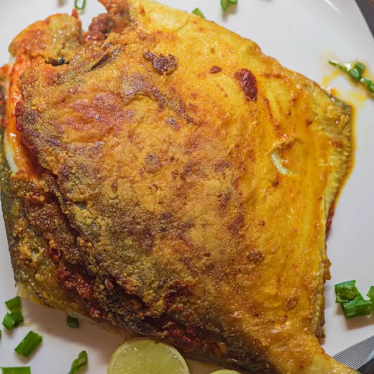 A pomfret with green masala stuffing.