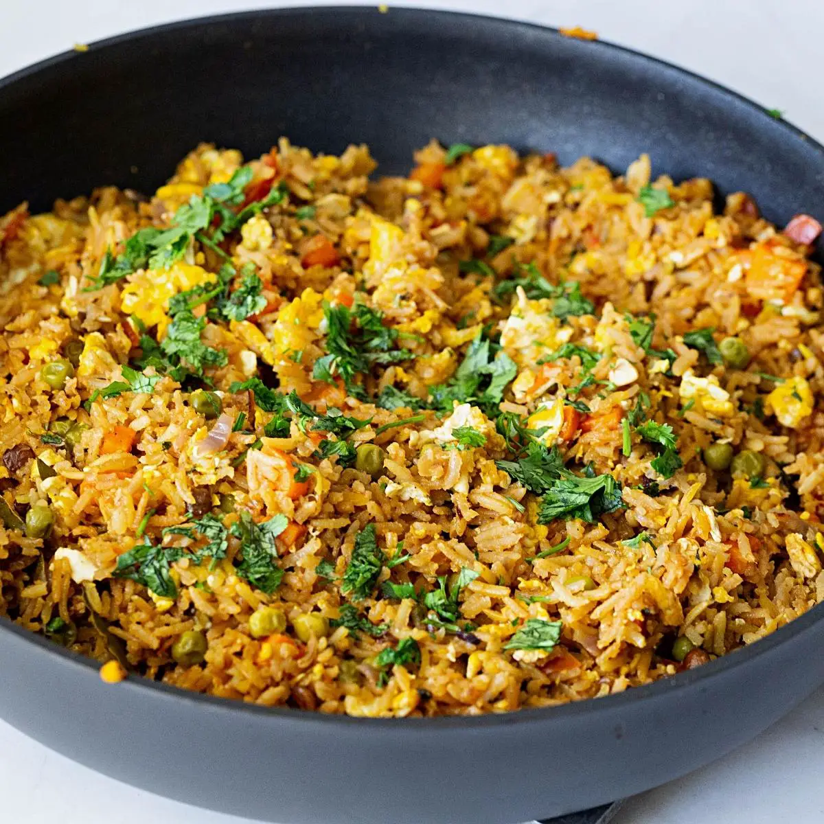 A skillet with fried rice.