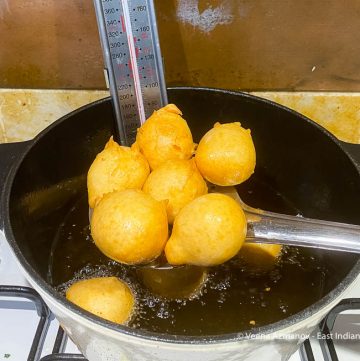 Fugias in a oil on a slotted spoon