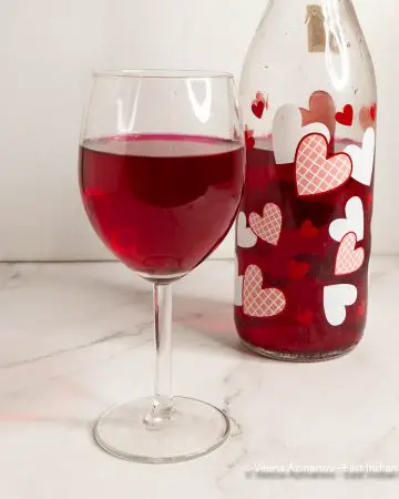 A wine glass with beetroot wine.