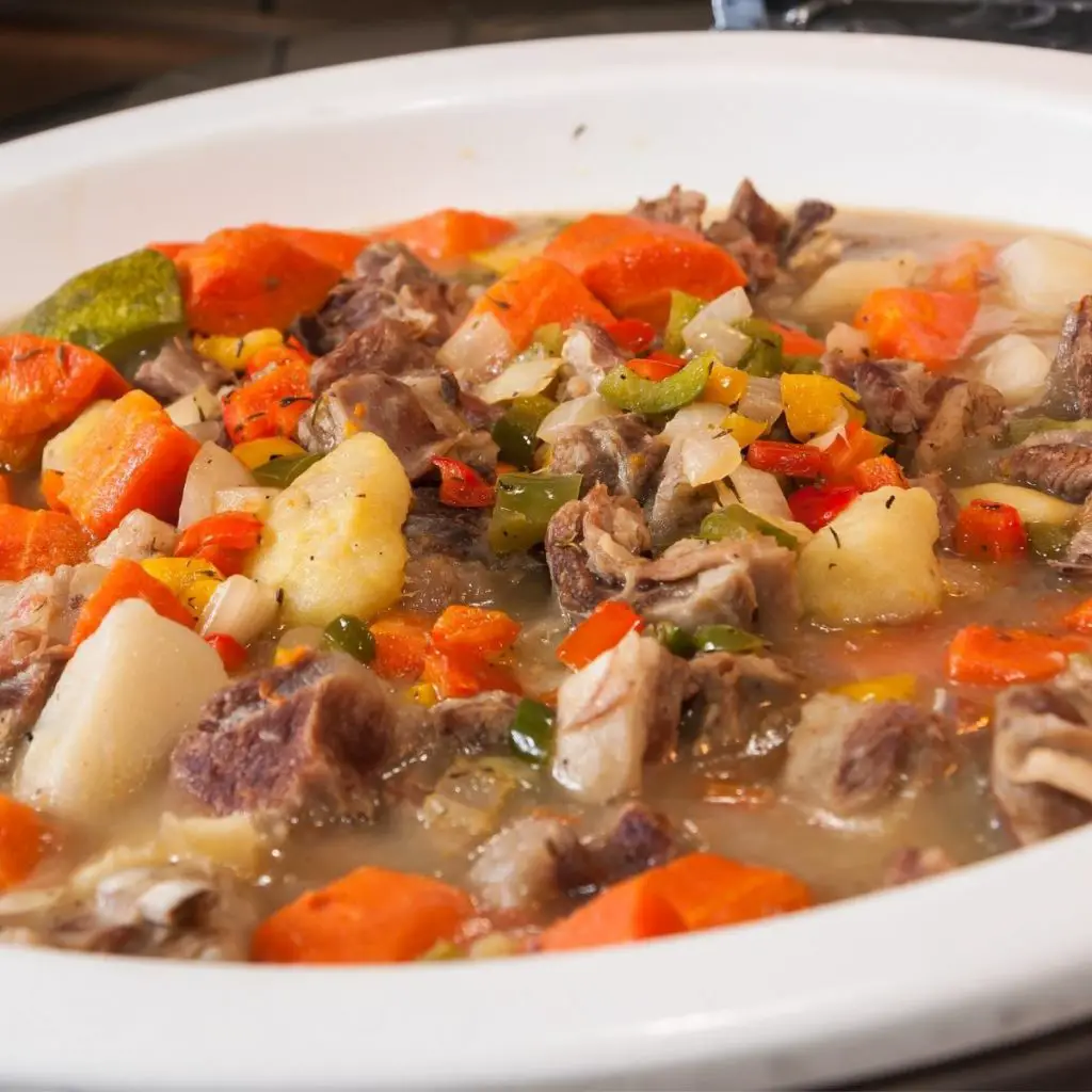 A white bowl with mutton stew.