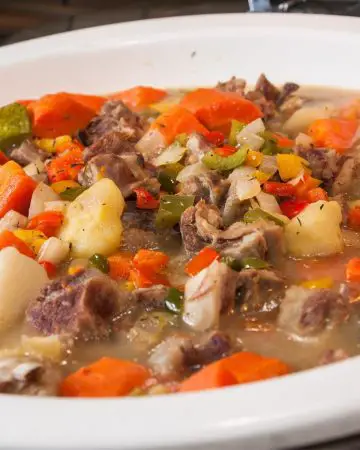 A white bowl with mutton stew.