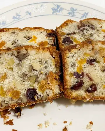 A plate with fruitcake with marzipan.