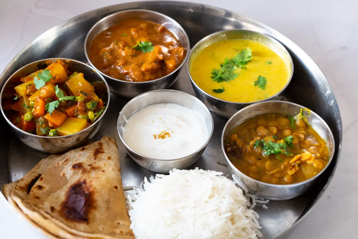 Vegetarian dishes in a thali.