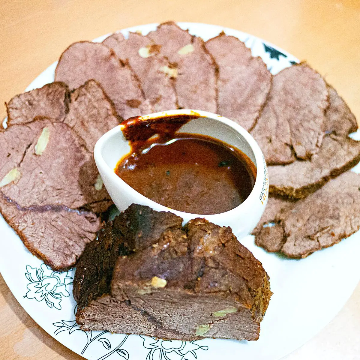 Roasted beef slices on the plate. 
