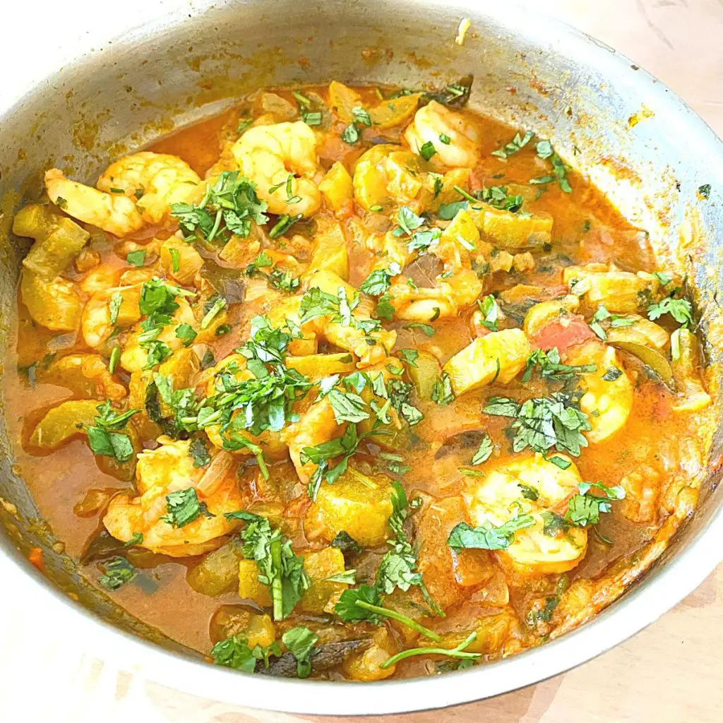 curry in a pan with prawns and pumpkin