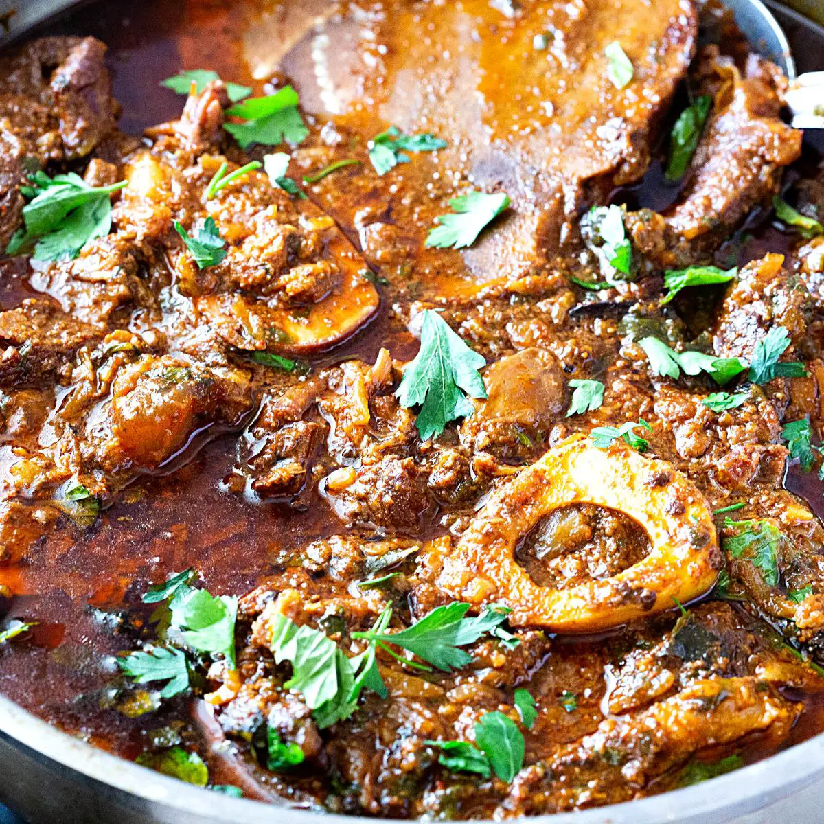 A stew with beef shanks in nihari curry.
