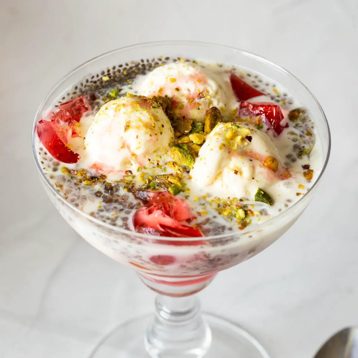 Cocktail glass with falooda and ice cream.