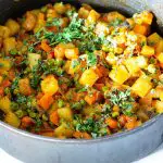 A skillet with Indian vegetable curry.
