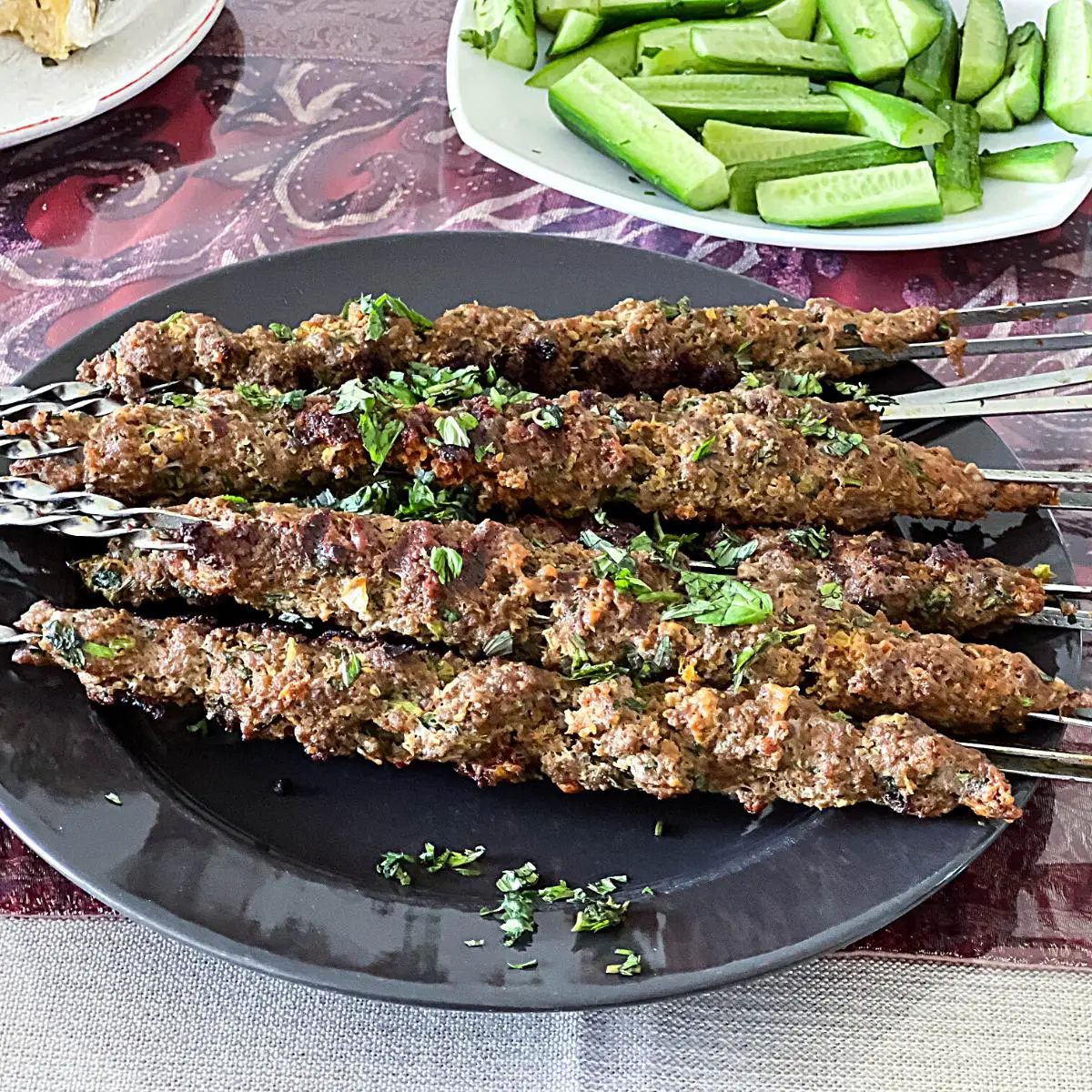 A plate with kebab skewers.