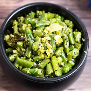 Green beans and coconut in a bowl.