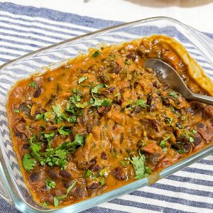 A glass casserole with beans.