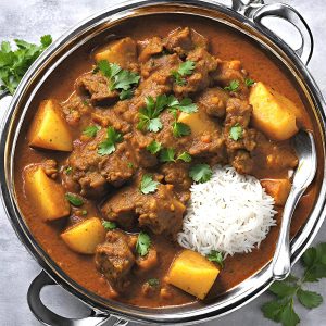Skillet with lamb potato curry.