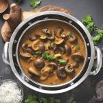 A skillet with mushroom curry.